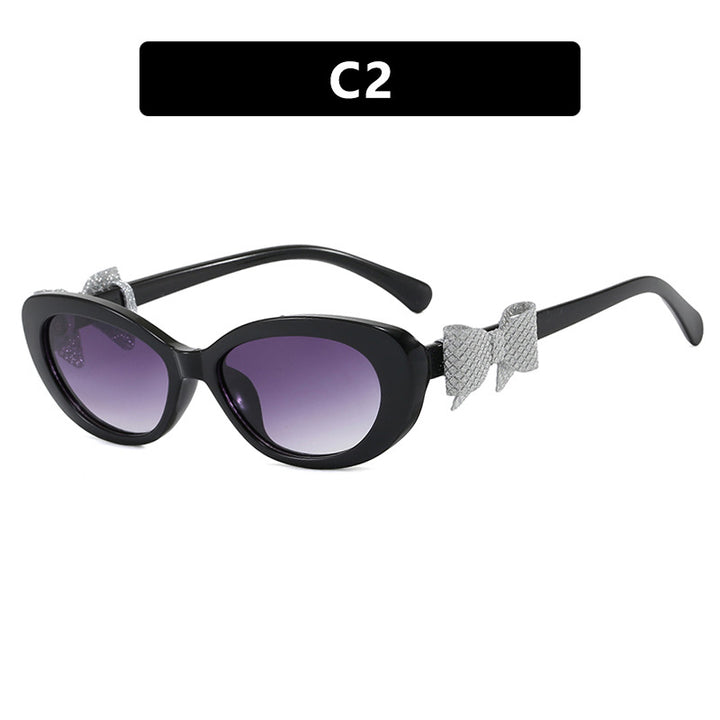 Dame moteriktig solbrille med lekent sløyfedesign Skanto