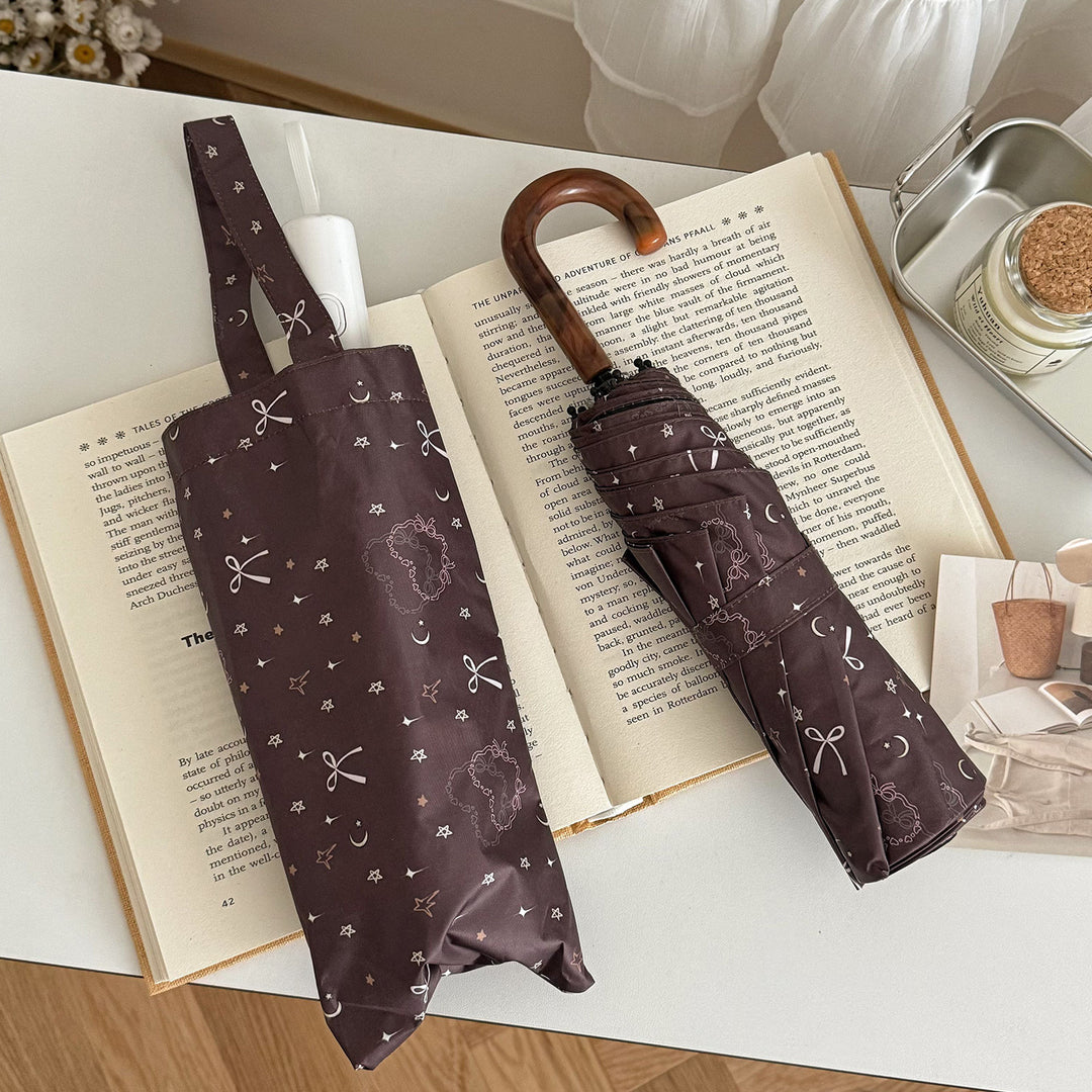 Dame sammenleggbart regnparaply med elegant anhengdesign Skanto