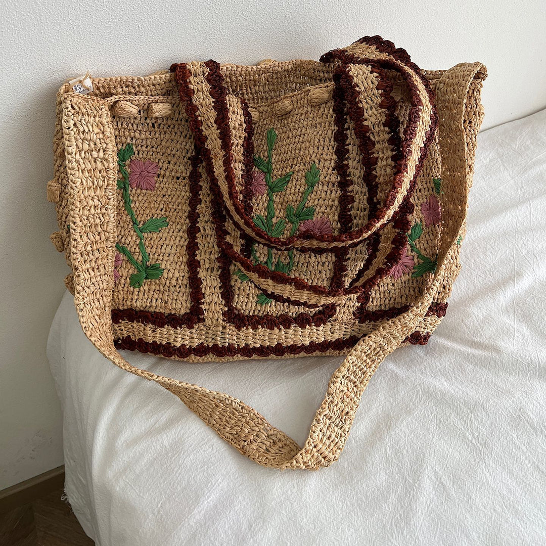 Flettet skulderveske med blomsterdesign Skanto