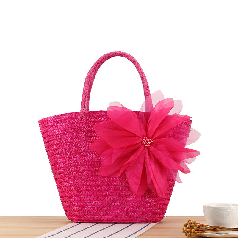 Elegant straw bag with floral accents Skanto