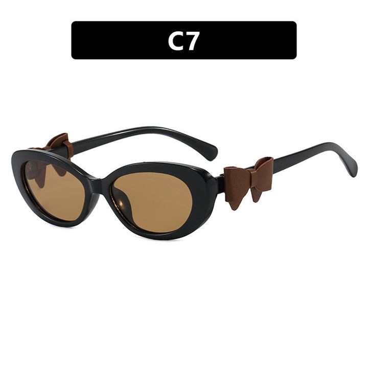 Dame moteriktig solbrille med lekent sløyfedesign Skanto