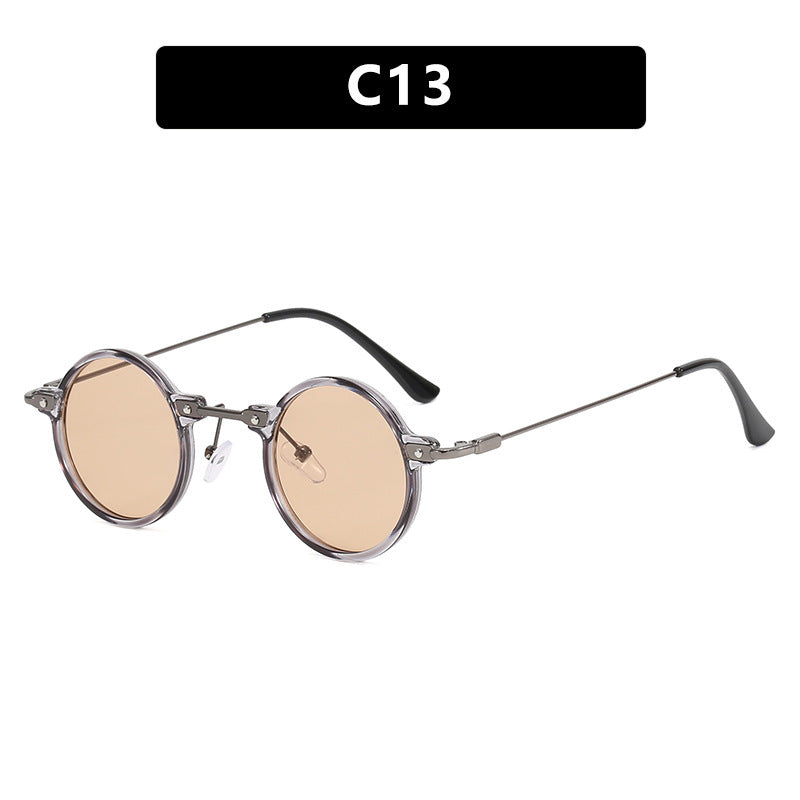 Dame rund solbrille med moderne metallramme og store blå linser Skanto