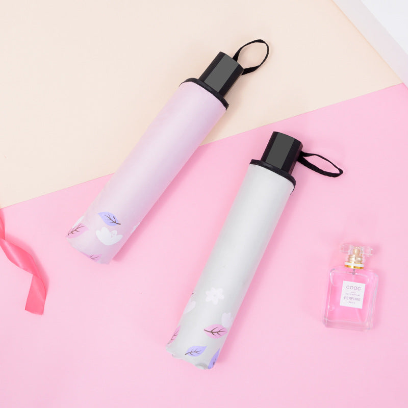 Dame sammenleggbar paraply med florale avslutninger Skanto