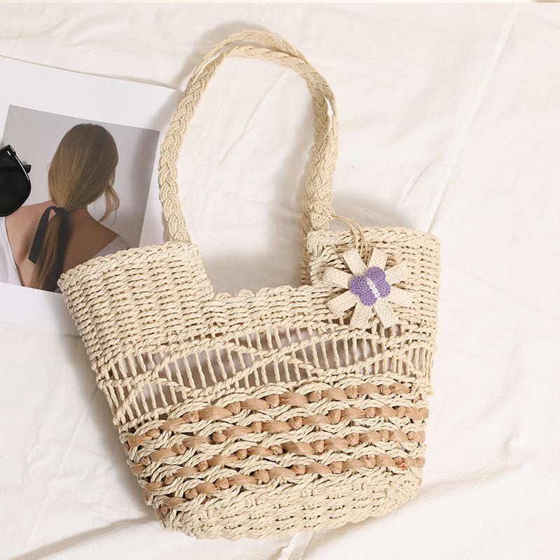 Braided basket bag with decorative floral appliqué Skanto