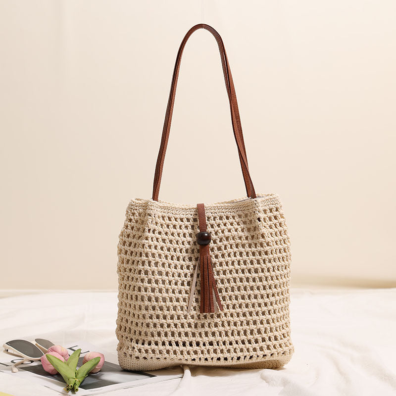 Hand-knotted basket bag with elegant leather handle Skanto
