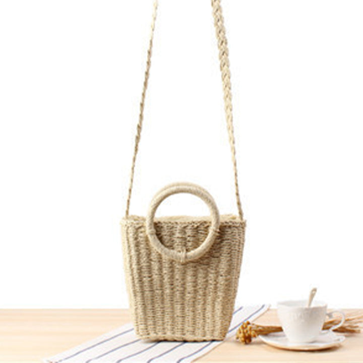 Woven natural material handbag with round handle Skanto