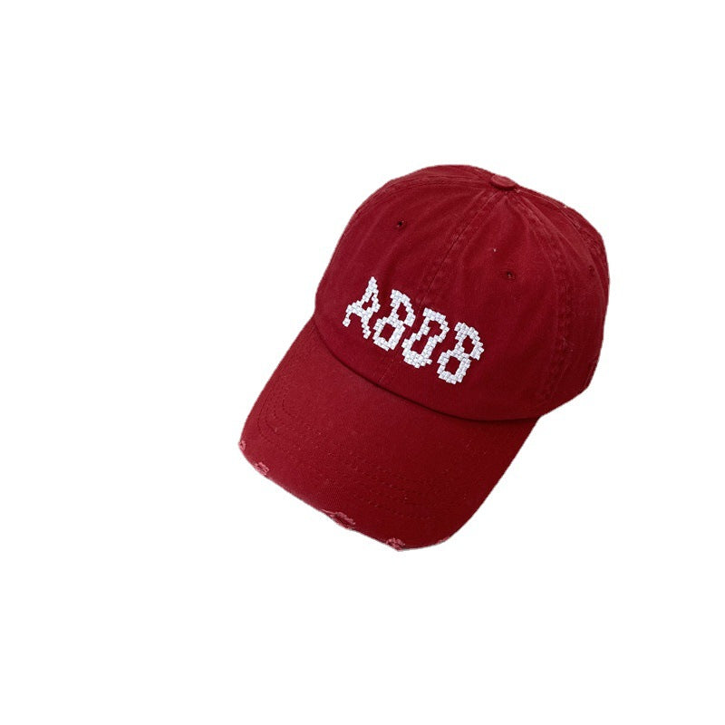 Kvinnens slitte bomull baseballcaps med grafisk detaljer Skanto