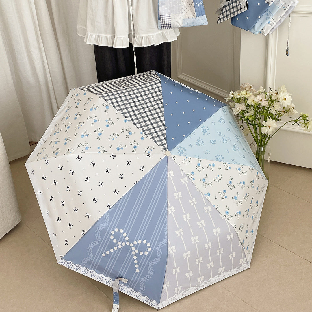 Damer paraply i romantisk patchwork-design Skanto