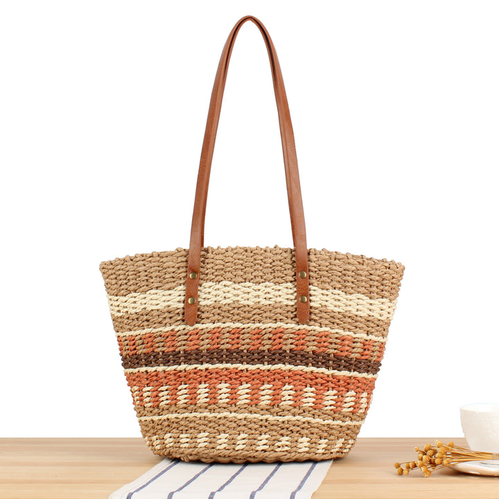 Tote bag made of woven natural material with elegant leather handles Skanto
