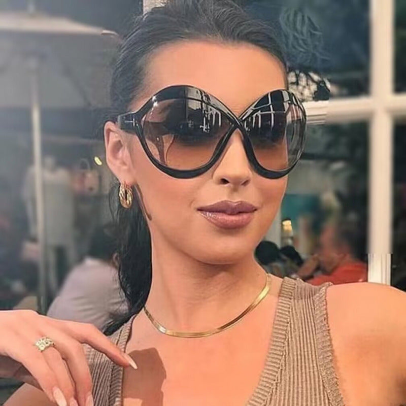 Dame ekstravagant formet solbrille Skanto