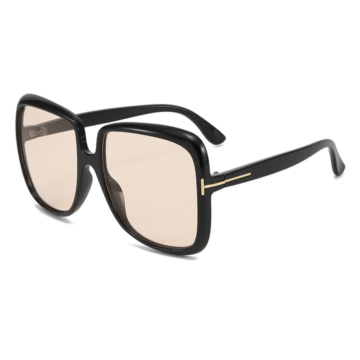 Dame elegant oversized solbrille med filigranramme Skanto