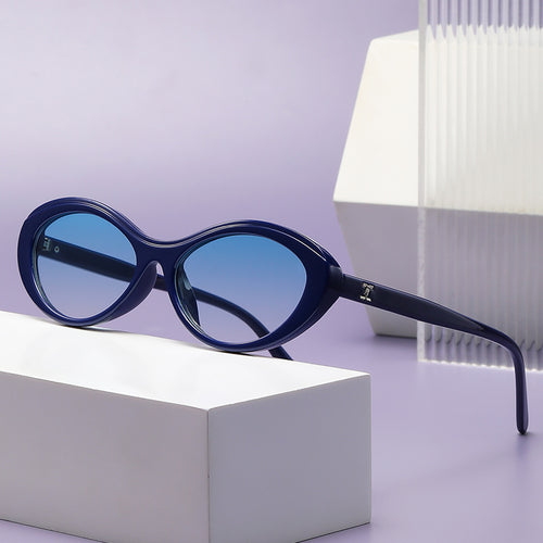 Dame stilige solbriller i oval design Skanto