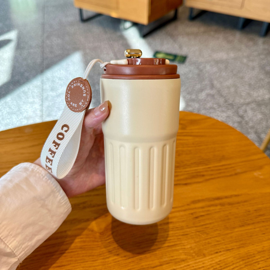 Dame isolert kaffekopp med praktisk håndholdtsløyfe Skanto
