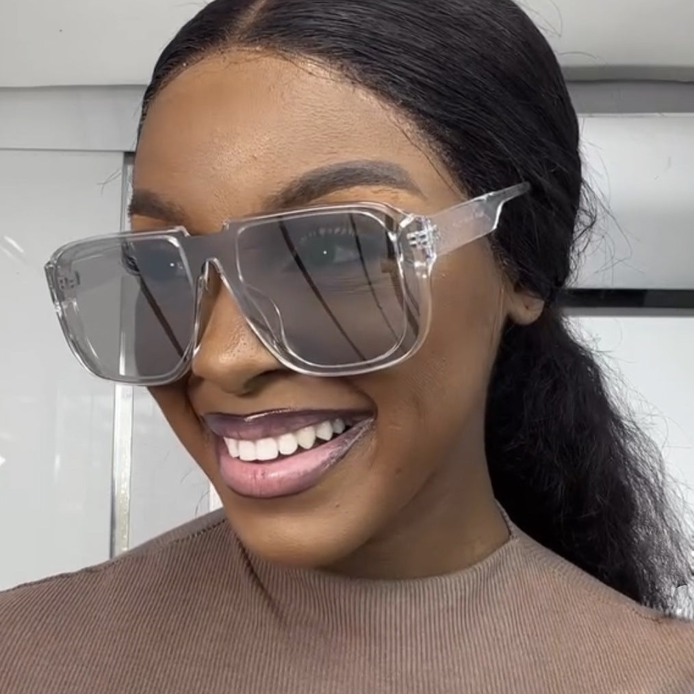 Women's trendy square sunglasses with transparent green frame and protective UV filter Skanto