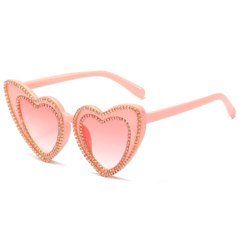 Dame hjerteformet solbrille med glitrende detaljer Skanto