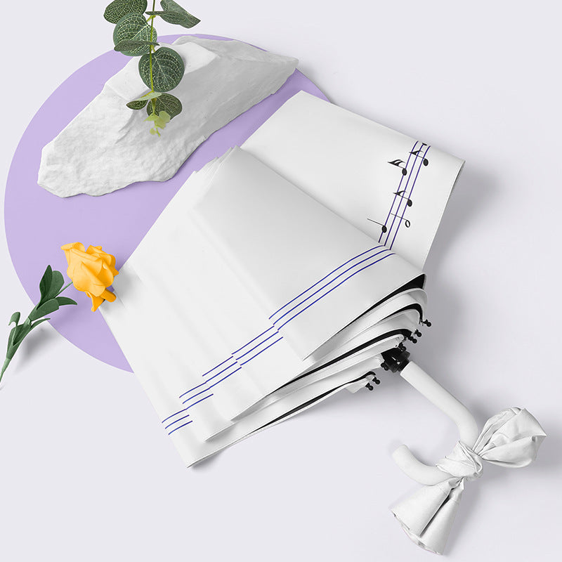 Dame sammenleggbart paraply med elegant hjerte-design Skanto
