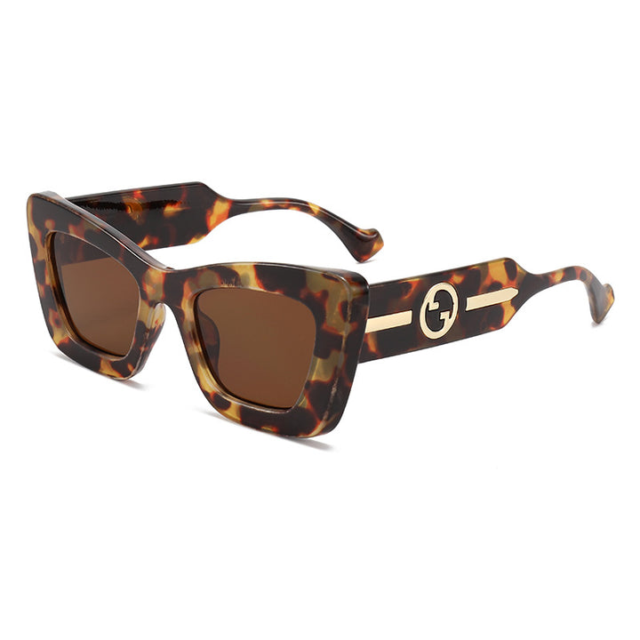 Dame designer solbrille med markant geometrisk ramme og høy kvalitet utførelse Skanto
