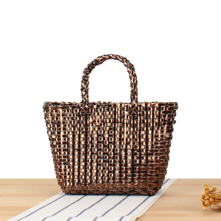 Handbag made of woven natural material with elegant accents Skanto