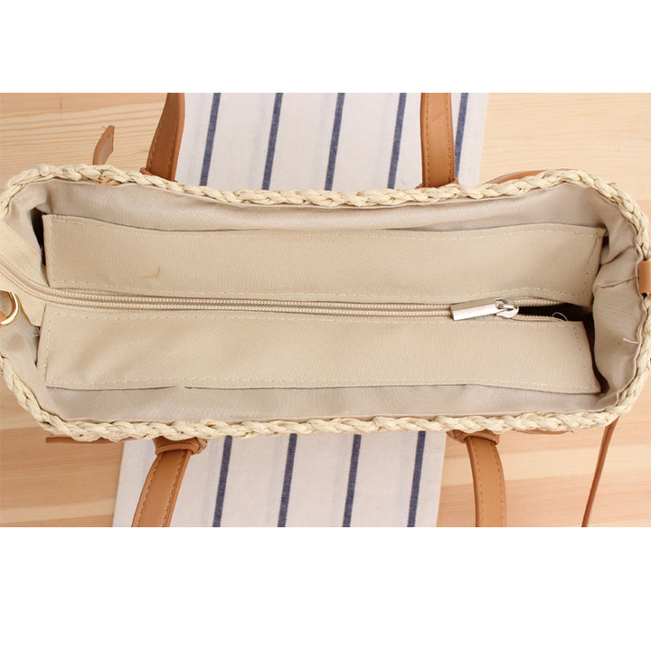 Woven natural material handbag with detachable leather handles Skanto