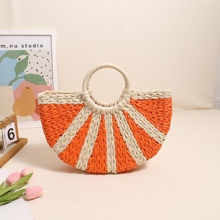 Handbag made of hand-woven raffia with structured base Skanto