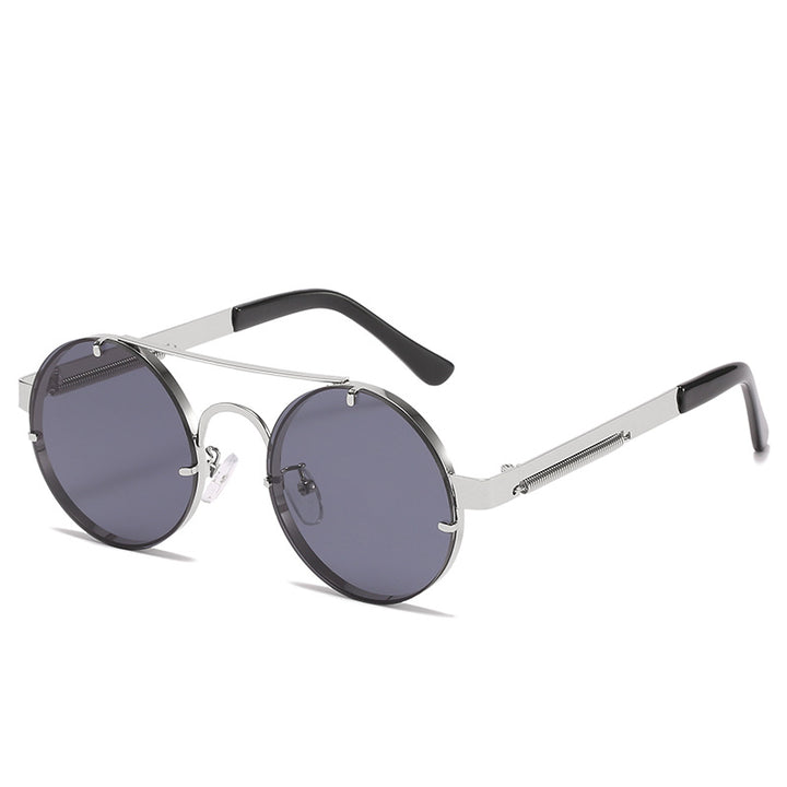 Dame rund designer solbrille med innovativ metallramme og beskyttende linser Skanto