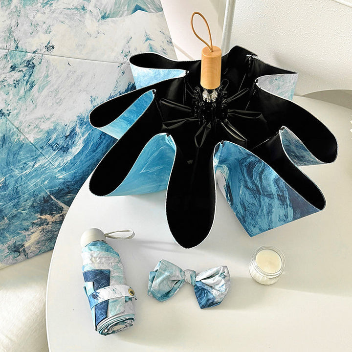Damer Sammenleggbart paraply med vannavstøtende motiv Skanto