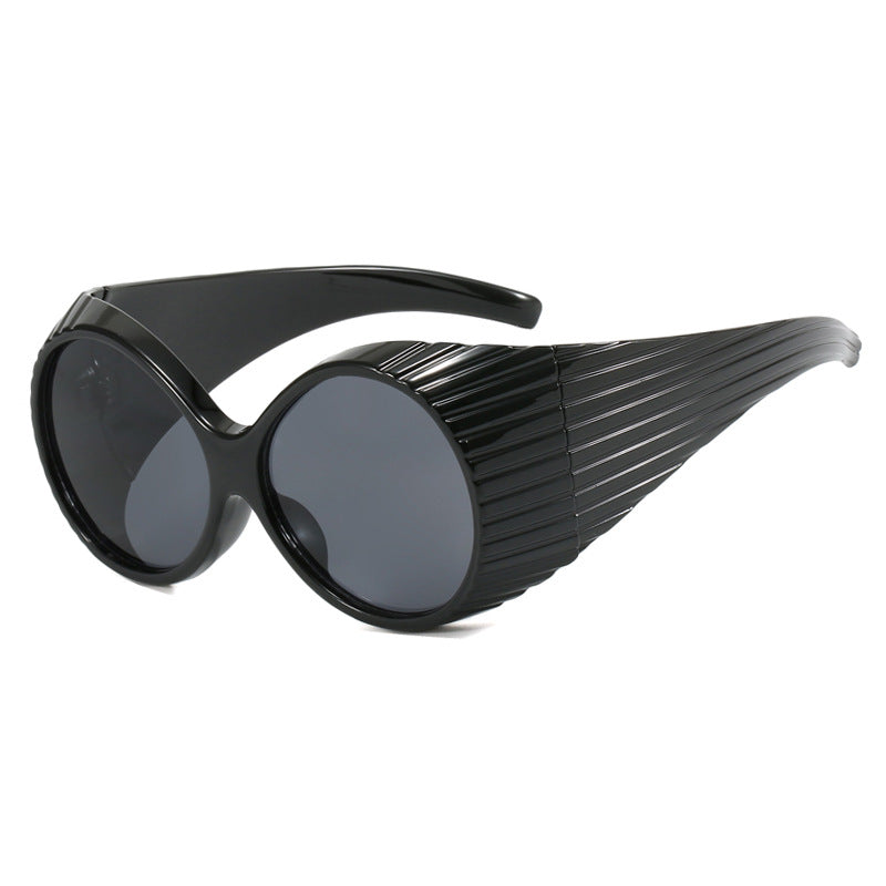 Women's extravagant sunglasses with curved frame Skanto