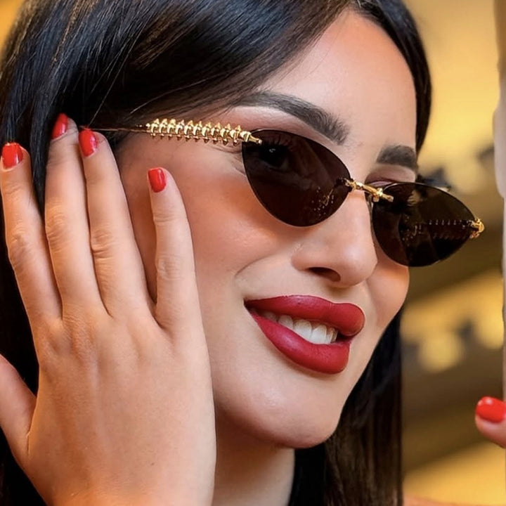 Women's sunglasses in modern, geometric design with stylish metal frame and UV protection Skanto