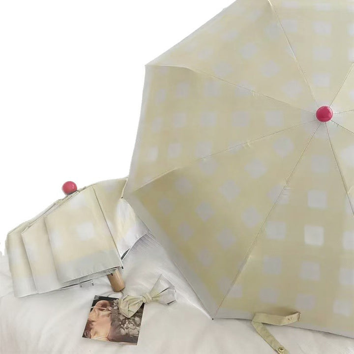 Dame sammenleggbart paraply med spesiell design Skanto