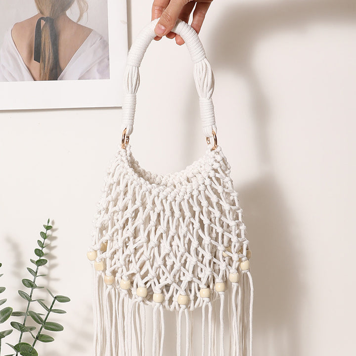 Macrame bag with decorative fringes and wooden beads Skanto