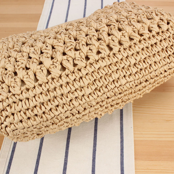 Handbag made of naturally coated braided material with elegant chain detail Skanto