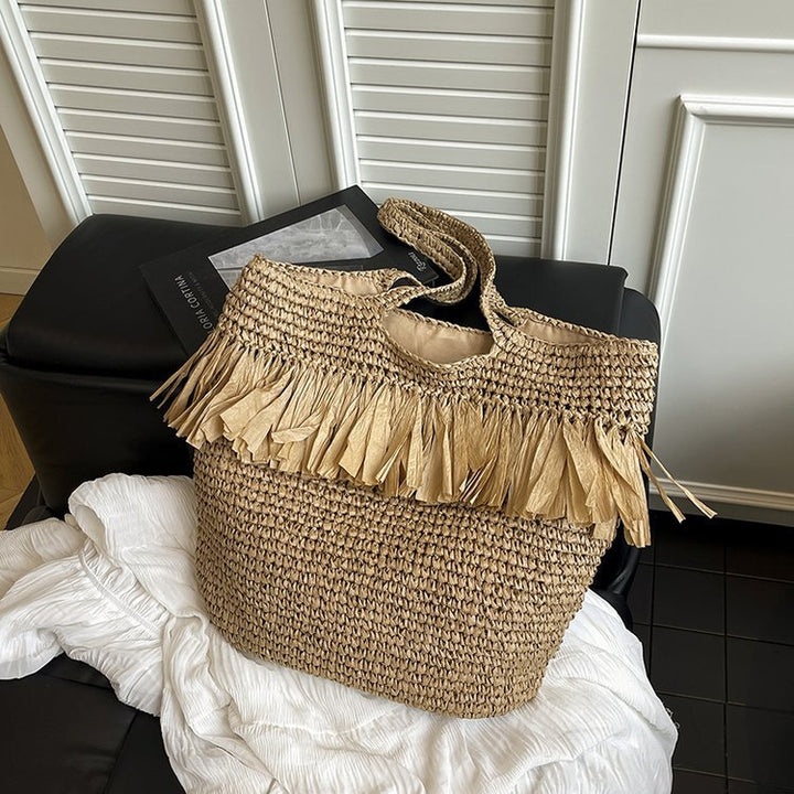 Elegant stråveske med frynse detaljer Skanto