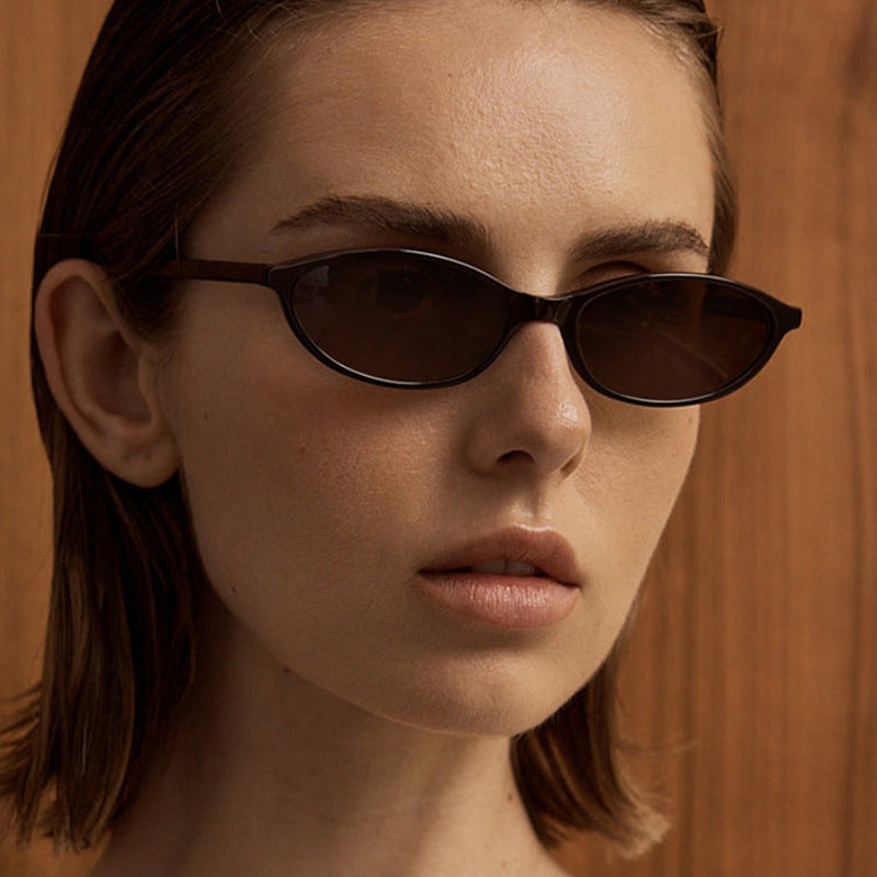 Women's oval sunglasses with transparent frame and UV protection Skanto