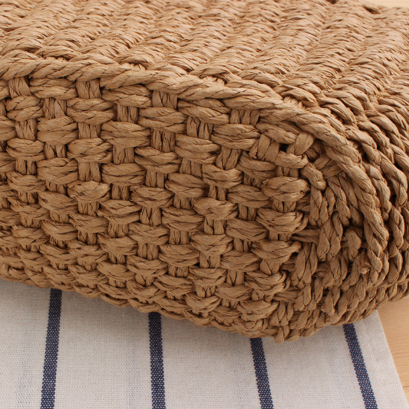 Handbag made of braided natural material with elegant fringe detail Skanto