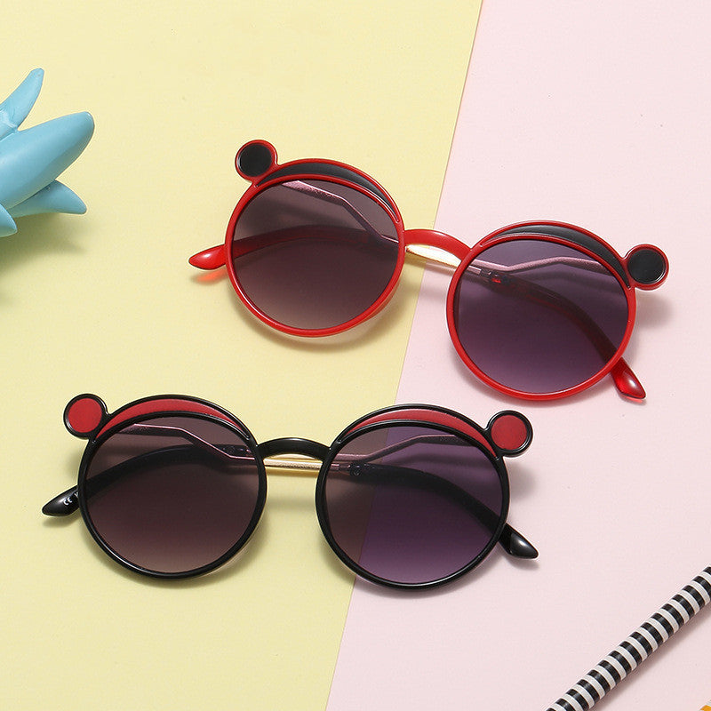 Dame Fashion-runde solbrille med innovativ ramme og fargede linser Skanto