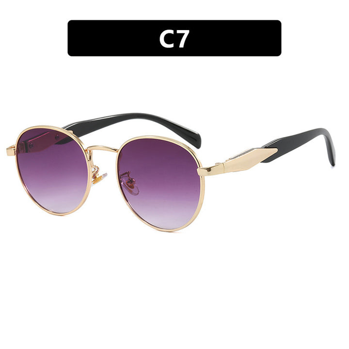 Dame rund solbrille med elegant, gullramme og UV-beskyttelse Skanto