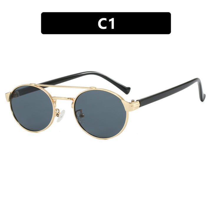 Women's fashionable sunglasses in stylish round design with gold accents Skanto