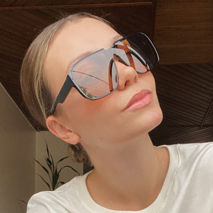 Women's trendy square sunglasses with transparent green frame and protective UV filter Skanto