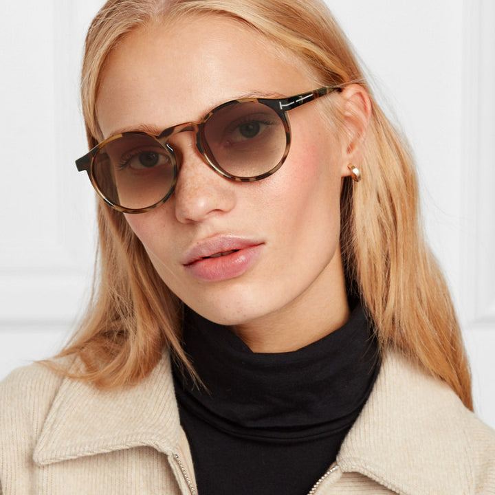 Dame moterik rund solbrille med elegant plastramme Skanto
