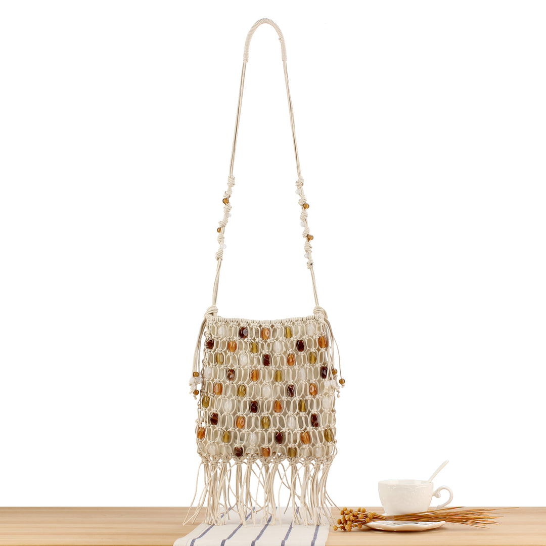 Handmade shoulder bag with decorative beads and fringes Skanto