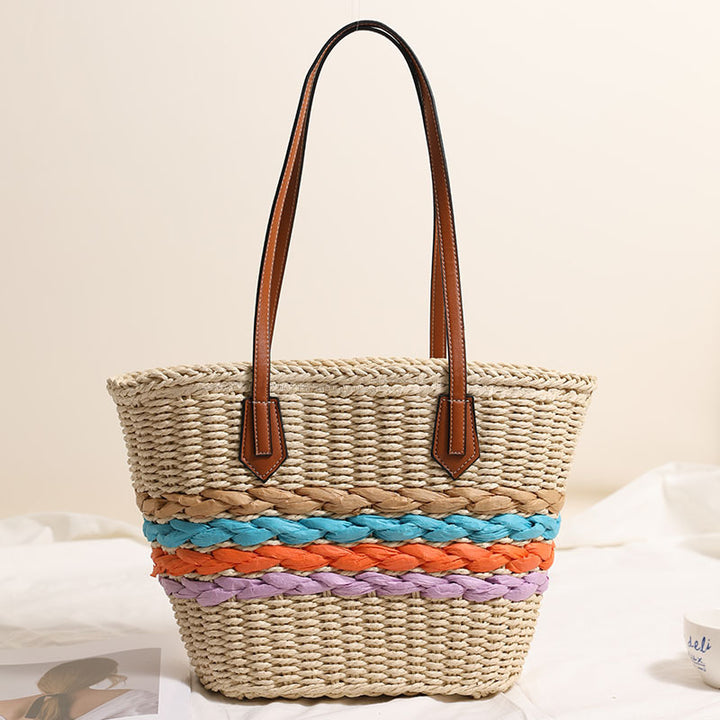Basket-style straw bag with colorful braided accents Skanto