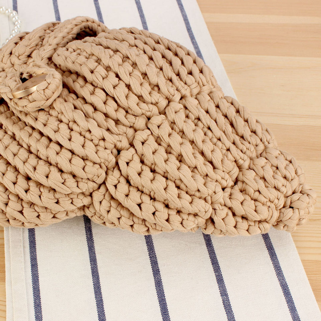 Elegant håndveske i muslingdesign Skanto