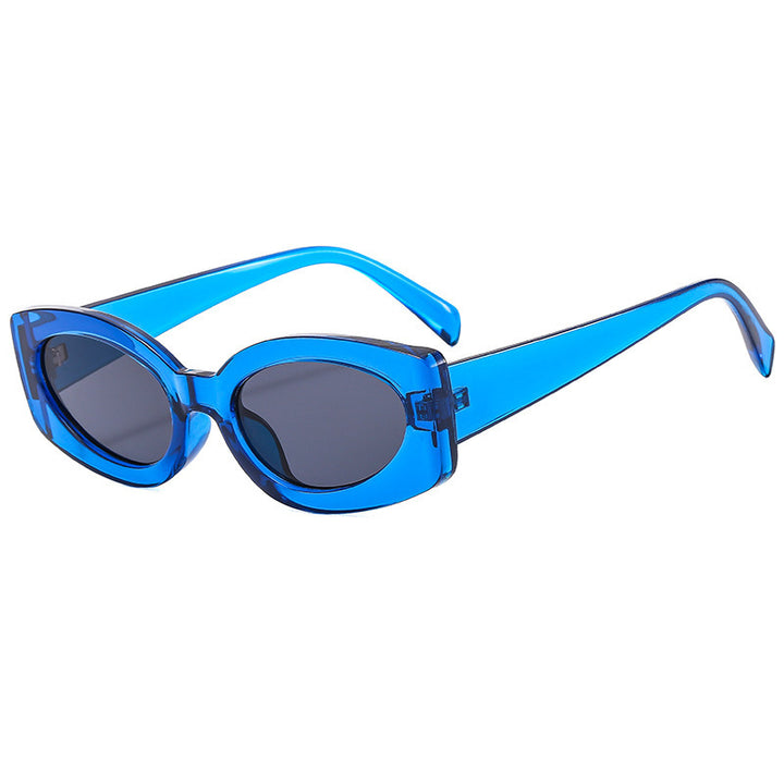 Dame moteriktig solbrille med unikt, bølget ramme Skanto