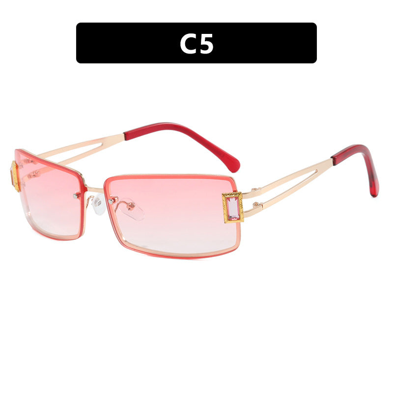 Stylish women's sunglasses with elegant trapezoidal lenses and filigree metal frame Skanto