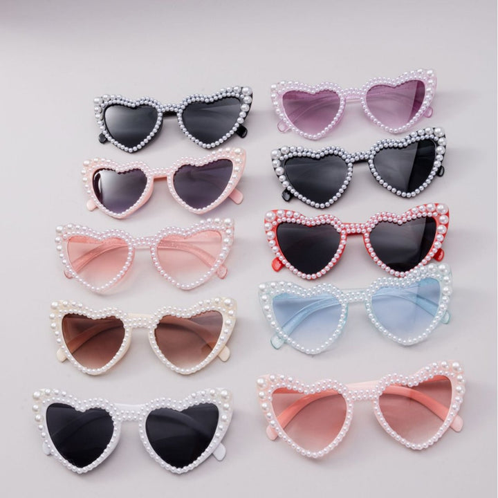 Dame designer solbrille med perleinnramming fra Skanto