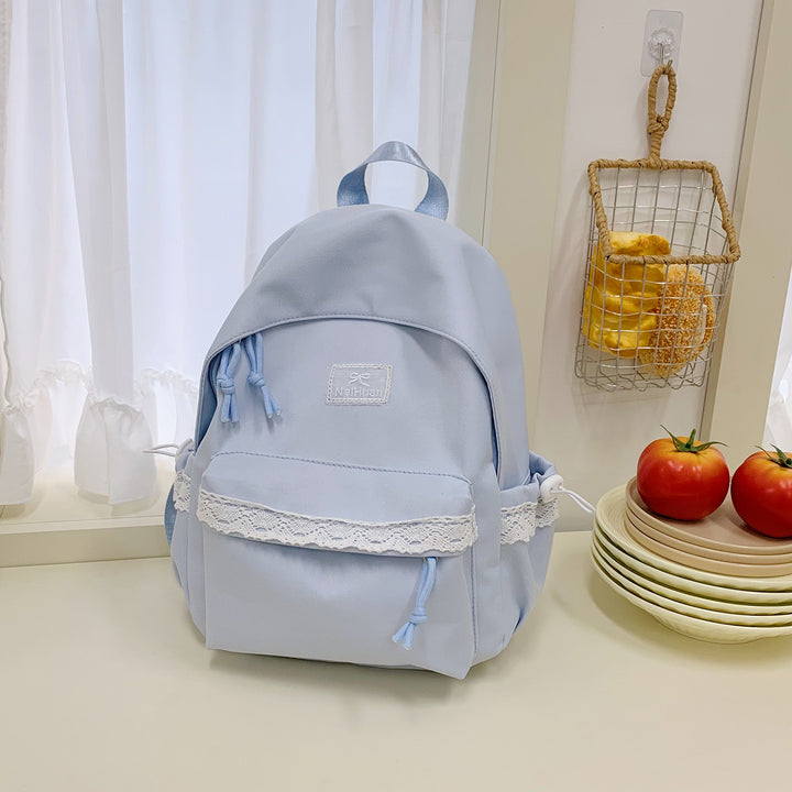 Elegant skolesekk med lacedetaljer