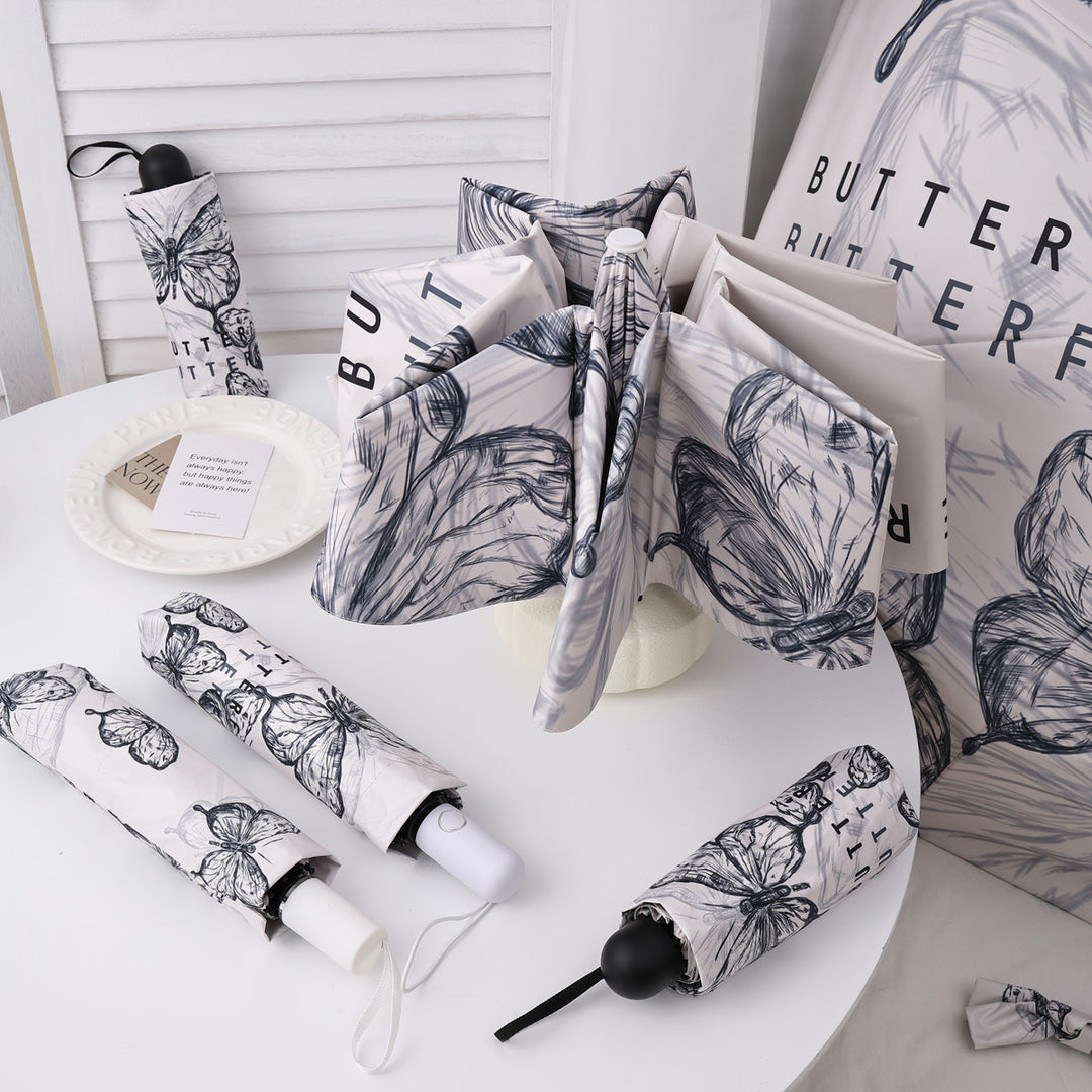 Dame fashionable foldeparaply med leken design Skanto