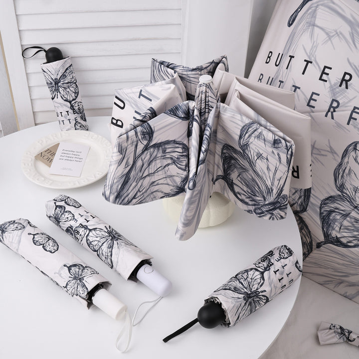 Dame fashionable foldeparaply med leken design Skanto
