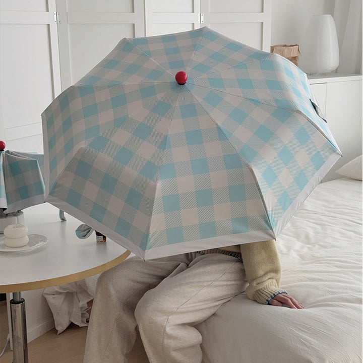 Dame sammenleggbart paraply med spesiell design Skanto