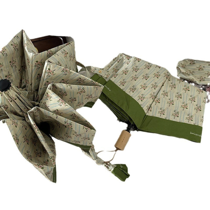 Dame elegant felle paraply med blomsterdesign Skanto
